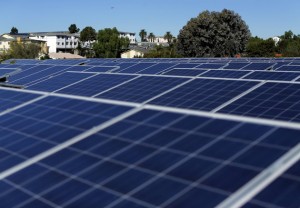 Solar panels are shown on top of a Multifamily Affordable Solar Housing-funded (MASH) housing complex in National City, California November 19, 2015. Picture taken November 19. To match Insight USA-SOLAR/MINORITIES REUTERS/Mike Blake